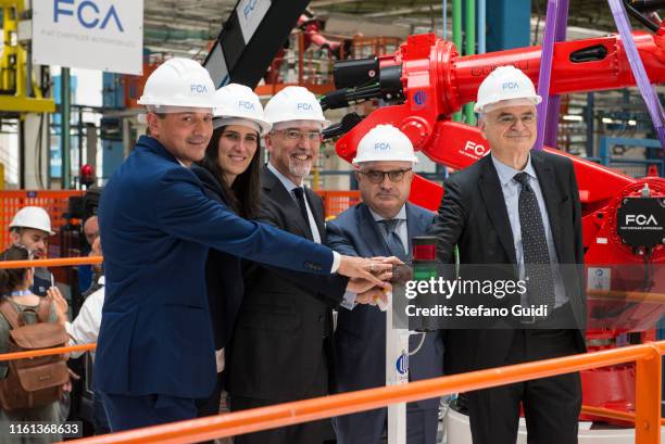 Claudio Palomba, Alberto Cirio, Pietro Gorlier, Chiara Appendino and Luigi Galante push the start button for the installation of the first robot of...