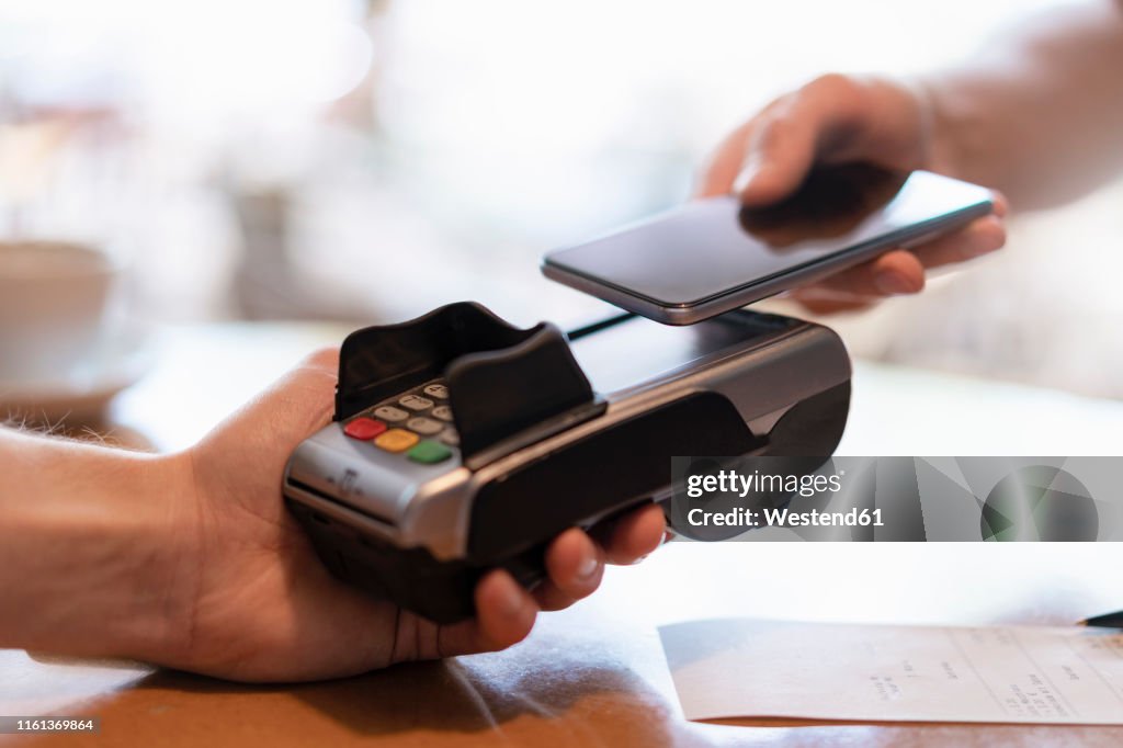 Contactless payment with smartphone, close-up