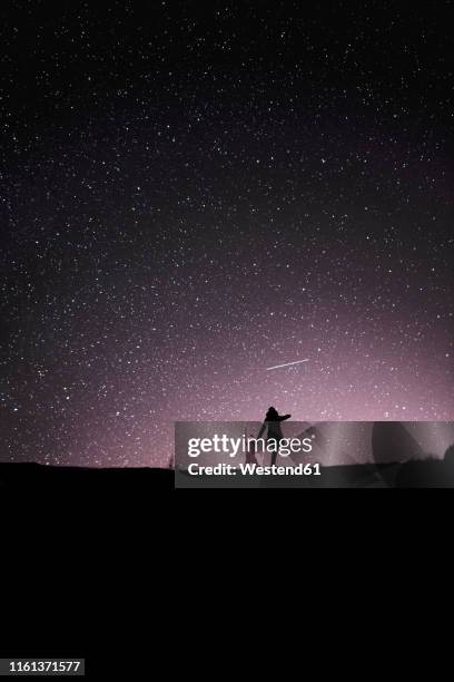 finland, kuopio, mother and daughter watching shooting star - kids astronomy stock pictures, royalty-free photos & images