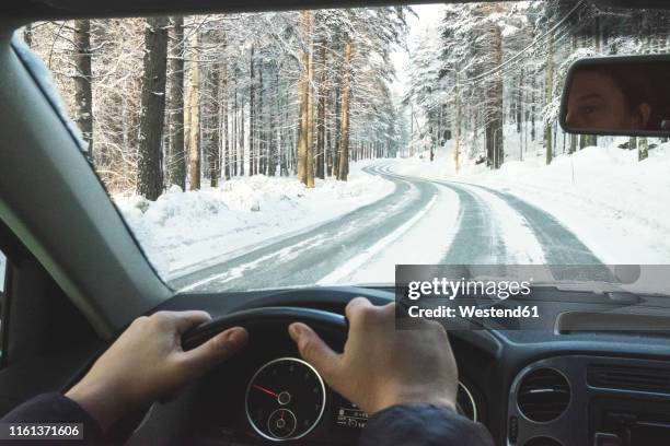 finland, kuopio, woman driving car in winter landscape - winter car window stock pictures, royalty-free photos & images