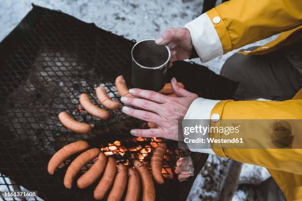 close-up of woman having a winter barbecue - bbq winter ストックフォトと画像