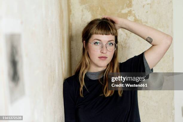 portrait of female student with tattoo - unterarm stock-fotos und bilder