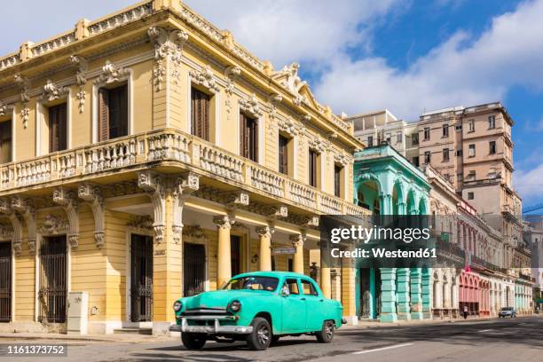 vintage car driving in front of colonial buildings, havana, cuba - havana stock pictures, royalty-free photos & images