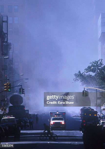 An ambulance rushes away from the World Trade Center area after the twin towers collapsed after being struck by a commerical airliner in a suspected...