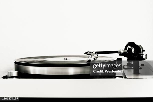 vinyl record on record player - deck stock pictures, royalty-free photos & images