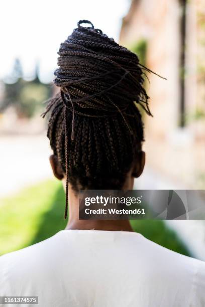 rear view of woman with afro hairstyle - frau zopf hinten stock-fotos und bilder