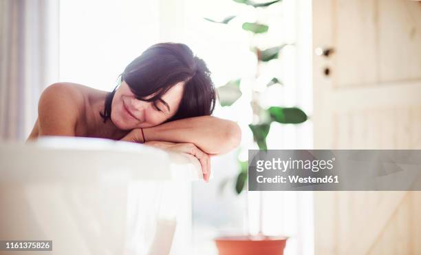 mature woman relaxing, taking a bath - beautiful woman bath stock-fotos und bilder
