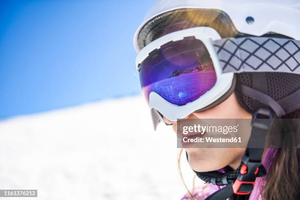 snowy landscape reflected in ski goggles ofa woman, sierra nevada, andalusia, spain - ski closeup imagens e fotografias de stock