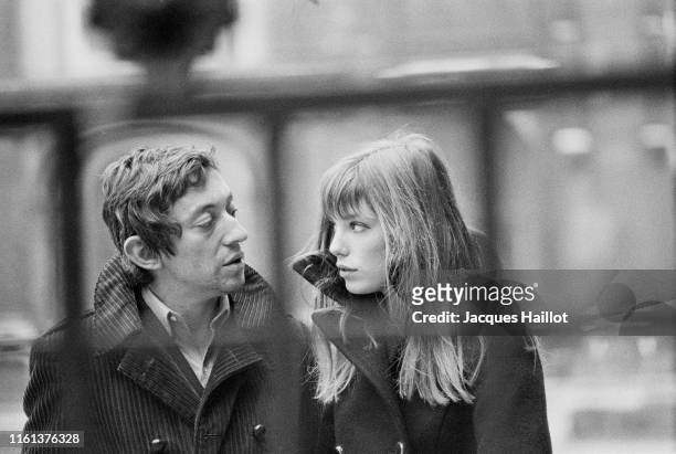 French singer and songwriter Serge Gainsbourg and his partner British singer and actress Jane Birkin in the courtyard of the French National College...