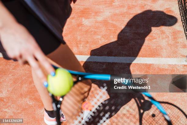 close-up of female tennis player on court - tennis raquet close up photos et images de collection