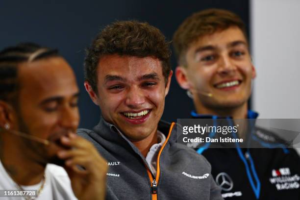 Lando Norris of Great Britain and McLaren F1 laughs in the Drivers Press Conference during previews ahead of the F1 Grand Prix of Great Britain at...