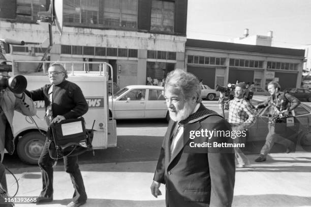 Dr. John Feegel, assistant Fulton County medical examiner, is followed by a television crew as he leaves the courthouse after testifying in the Wayne...