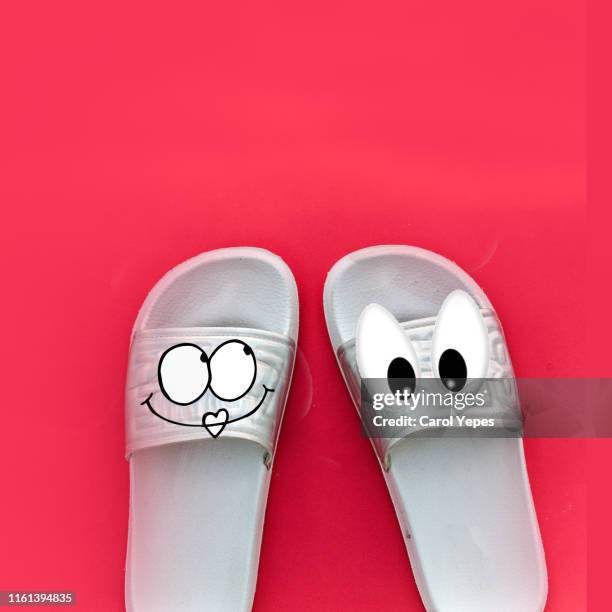 flip flop with happy faces.pink background - 2 peas in a pod stock pictures, royalty-free photos & images