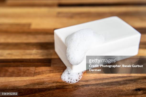 a close-up of a white organic bar of soap / shampoo - soap dish stock pictures, royalty-free photos & images