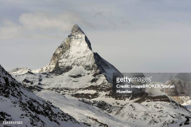 mt. matterhorn in winter, zermatt, valais, switzerland - spitz type dog stock pictures, royalty-free photos & images
