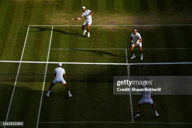 Juan Sebastian Cabal of Colombia, playing partner of Robert Farah of Colombia plays a forehand in their Men's Doubles semi-final match against Raven...