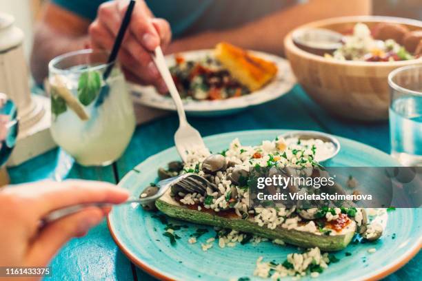 couple eating healthy food - mediterranean food stock pictures, royalty-free photos & images