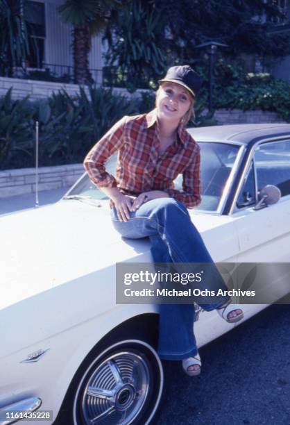 Actress Denise Nickerson poses for a portrait session with her Ford Mustang at home in circa 1976 in Los Angeles, California.