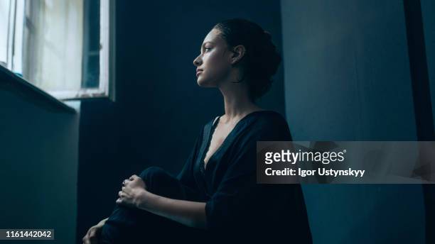 portrait of young sad woman - solitude stock pictures, royalty-free photos & images