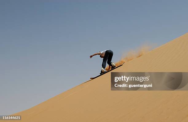 sandboarding in the sahara - sand boarding stock pictures, royalty-free photos & images