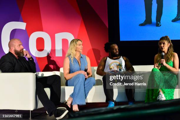 Superstar Triple H, WWE Superstar Charlotte Flair, WWE Superstar Xavier Woods and WWE Moderator Cathy Kelley attend 2019 VidCon at Anaheim Convention...
