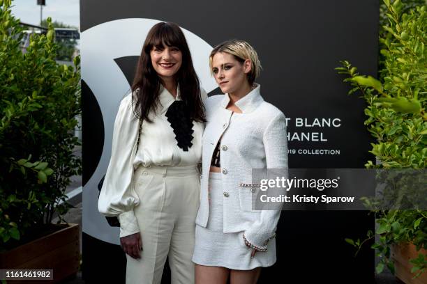 Lucia Pica and Kristen Stewart attend the Noir et Blanc de Chanel Fall/Winter 2019 Makeup Collection - Yachts De Paris on July 11, 2019 in Paris,...