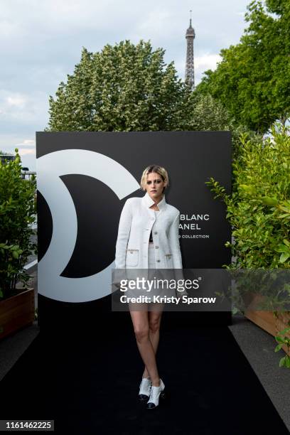 Kristen Stewart attends the Noir et Blanc de Chanel Fall/Winter 2019 Makeup Collection - Yachts De Paris on July 11, 2019 in Paris, France.