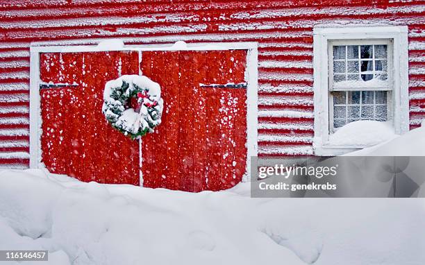 snowed in at christmas - wreath on barn door stock pictures, royalty-free photos & images