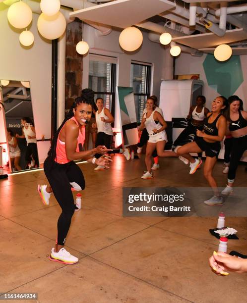 Deja Riley leads a high-intensity workout class as PUMA And Refinery29 Host The Launch Of The New PUMA LQD CELL Shatter Shoe at Refinery29 on July...