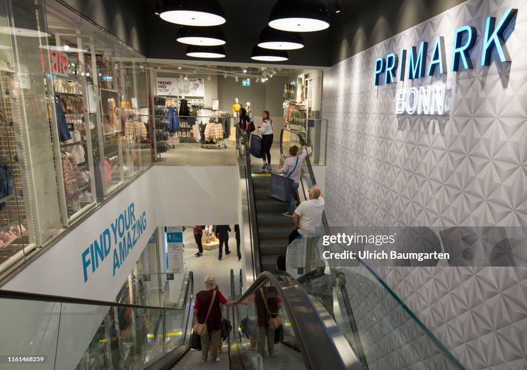 Opening of a Primark branch in Bonn. Interior view with escalator, sales room and visitors.