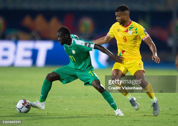 Papa Alioune Ndiaye of Senegal and Steve Mounie of Benin during the 2019 Africa Cup of Nations quarter-final match between Senegal and Benin at 30th...