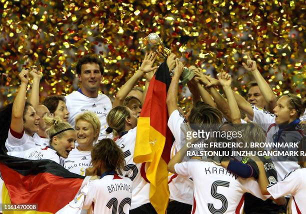 Germany's players celebrate in the podium after winning against Brazil during the final match in the FIFA Women's World Cup 2007 football tournament...
