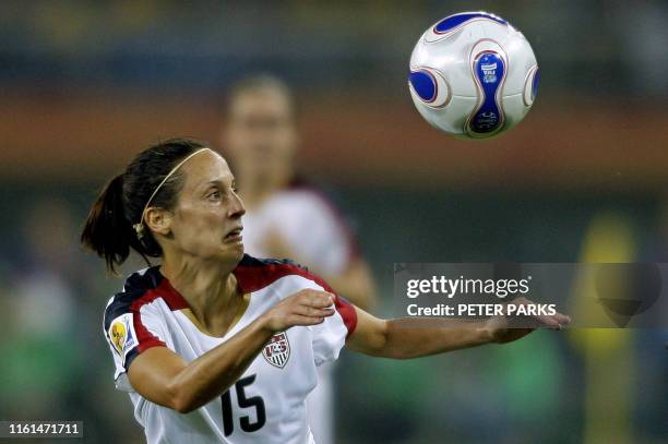 Kate Markgraf of the USA keeps her eye on the ball during a quarterfinal match against England, in the FIFA Women's World Cup football tournament at...