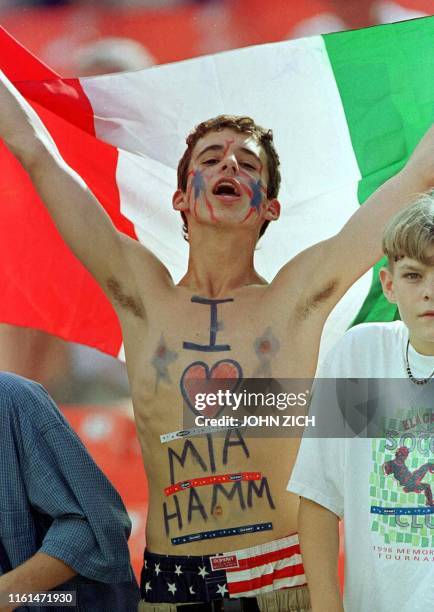 Tom Valenti of Woodridge, Illinois shows his mixed allegiances by proudly waving an Italian flag, but proclaiming that his heart belongs to US soccer...