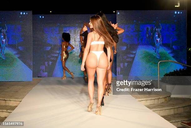 Models walk the runway during the Oh Polly Fashion Show At Miami Swim Week 2019 Produced By Planet Fashion at Kimpton Surfcomber Hotel on July 11,...