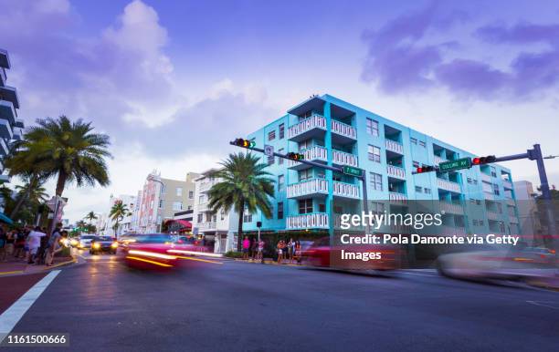ocean drive daylight scene at south beach, miami, usa. - miami art deco stock pictures, royalty-free photos & images
