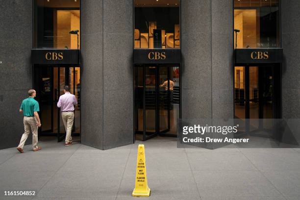 People enter the CBS Building, which headquarters the CBS Corporation, in Midtown Manhattan on August 13, 2019 in New York City. Following years of...