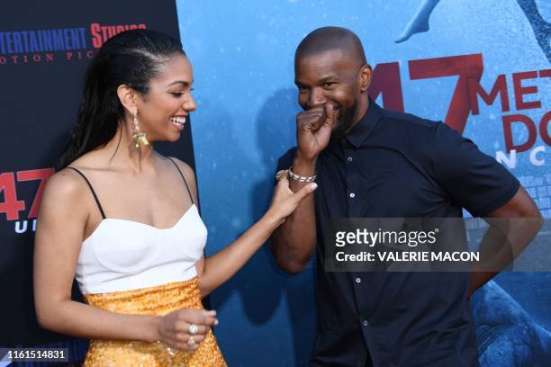 Actress and model Corinne Foxx and her father US actor Jamie Foxx attend the premiere of "47 Meteres Down: Uncaged" at the Regency Village Theatre in...