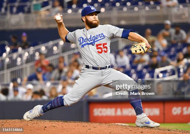 Russell Martin of the Los Angeles Dodgers delivers a pitch in the ninth inning against the Miami Marlins at Marlins Park on August 13, 2019 in Miami,...