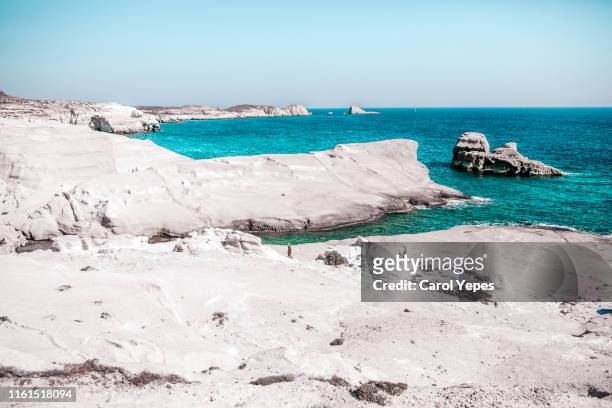 sarakiniko pinturesque beach in milos,greece - milos stock pictures, royalty-free photos & images