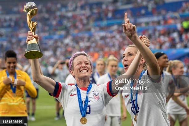 Megan Rapinoe of the USA celebrates with the FIFA Women's World Cup Trophy following her team's victory in the 2019 FIFA Women's World Cup France...