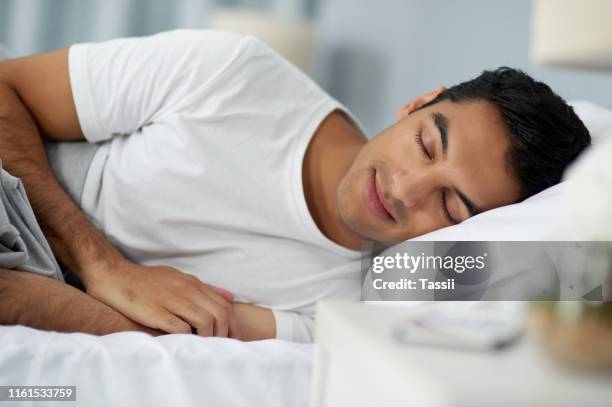 how i sleep when i have no alarm set - man sleeping stock pictures, royalty-free photos & images