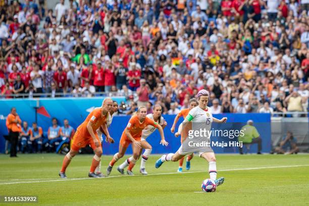 Megan Rapinoe of the USA scores her team's first goal during the 2019 FIFA Women's World Cup France Final match between The United States of America...
