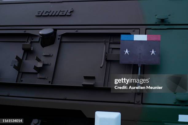 View of the French flag and the two stars of the command car on the Champs Elysee during the Bastille Day military ceremony rehearsals on July 12,...