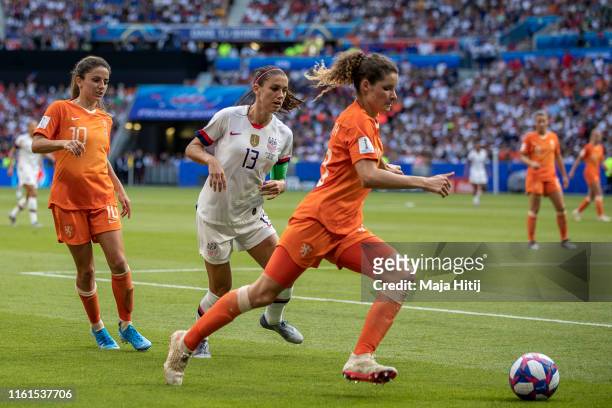 Alex Morgan of the USA and Dominique Bloodworth of the Netherlands battle for possession during the 2019 FIFA Women's World Cup France Final match...