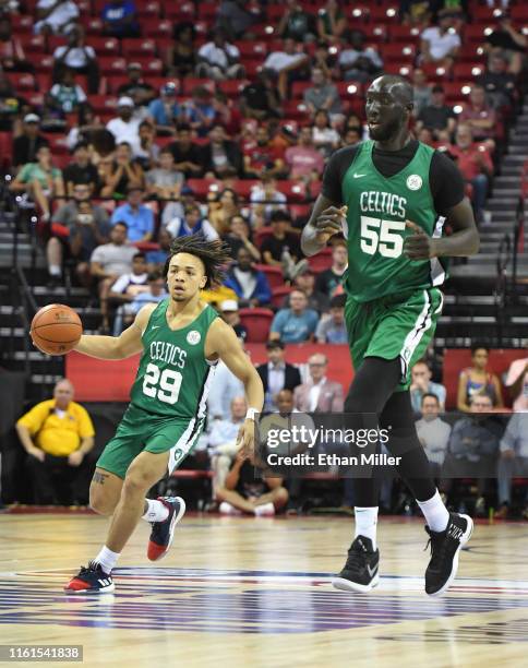 Carsen Edwards of the Boston Celtics brings the ball up the court alongside teammate Tacko Fall during a game against the Memphis Grizzlies during...