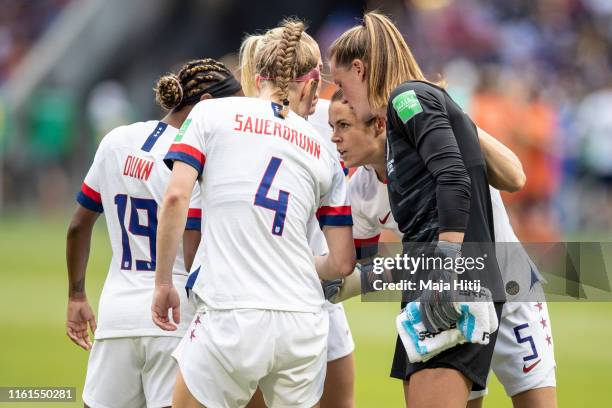 Kelley O'Hara and the players of the USA huddle prior to during the 2019 FIFA Women's World Cup France Final match between The United State of...