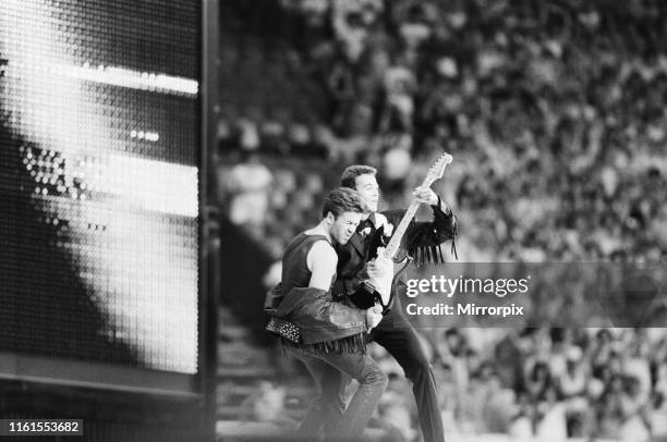 Wham, The Farewell Concert at Wembley Stadium, London England George Michael and Andrew Ridgeley on stage. 28th June 1986.