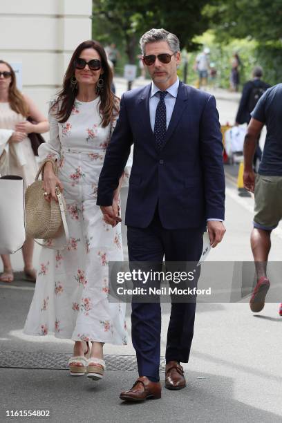 Eric Bana and Rebecca Gleeson attend day 11, the Mens semi-finals at the Wimbledon 2019 Tennis Championships at All England Lawn Tennis and Croquet...