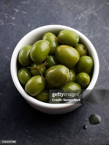 olives - green olive fruit stock pictures, royalty-free photos & images